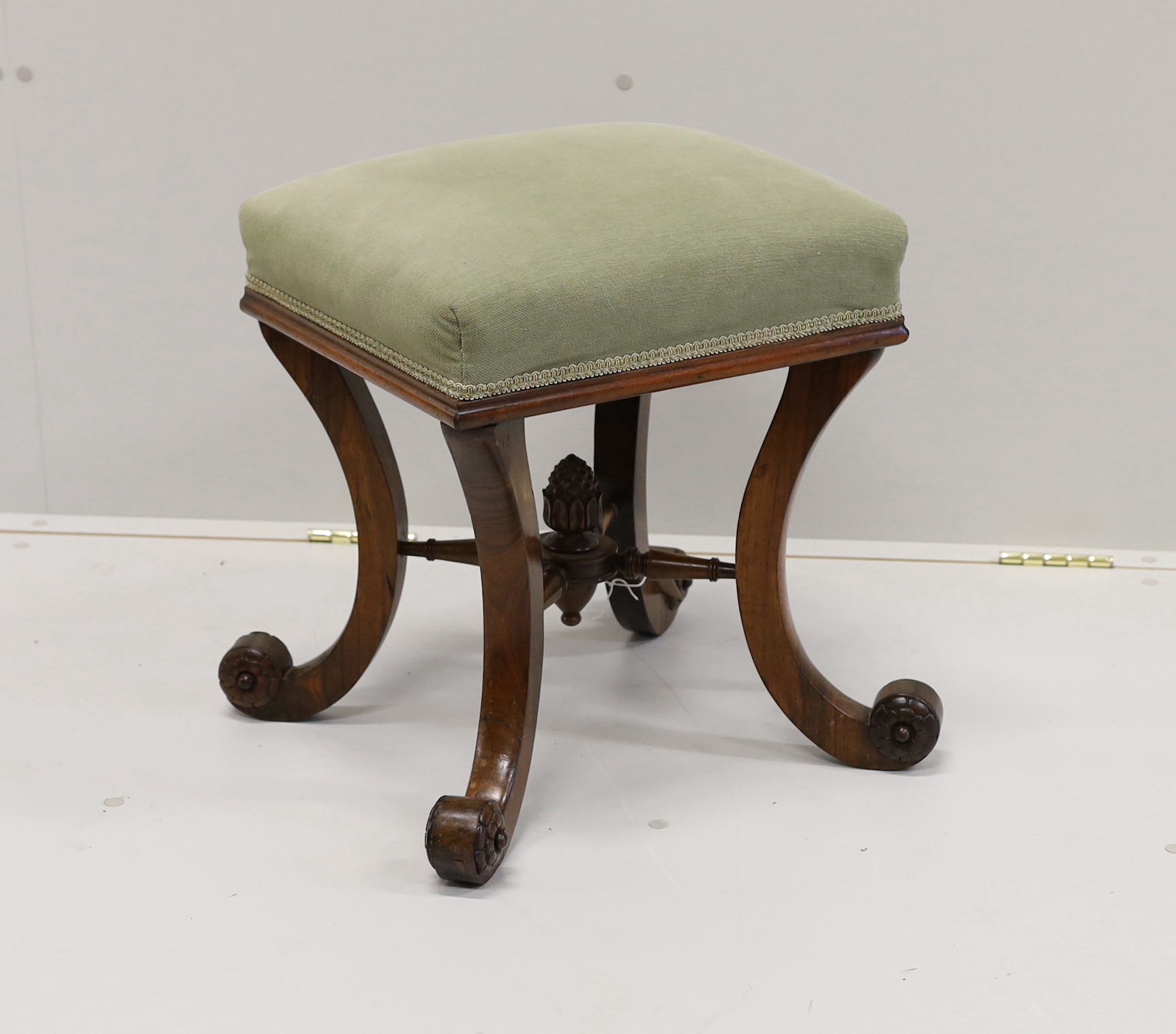 A Victorian rosewood dressing stool on scrolled supports, width 46cm, height 48cm